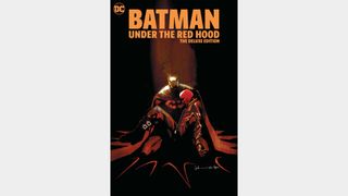 Batman holding Red Hood