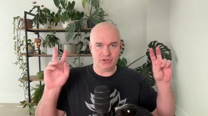 Chris Wilson doing air quotes with fingers