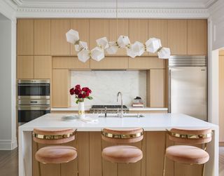 a modern kitchen with full height cabinets