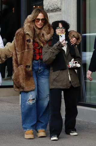 jennifer lopez wears a fur coat and platform R13 boots in aspen on christmas eve