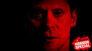 Actor Neil Newbon as Chase, a character in Dead Take standing in front of a camera with a red overlay and horizontal digitized lines.