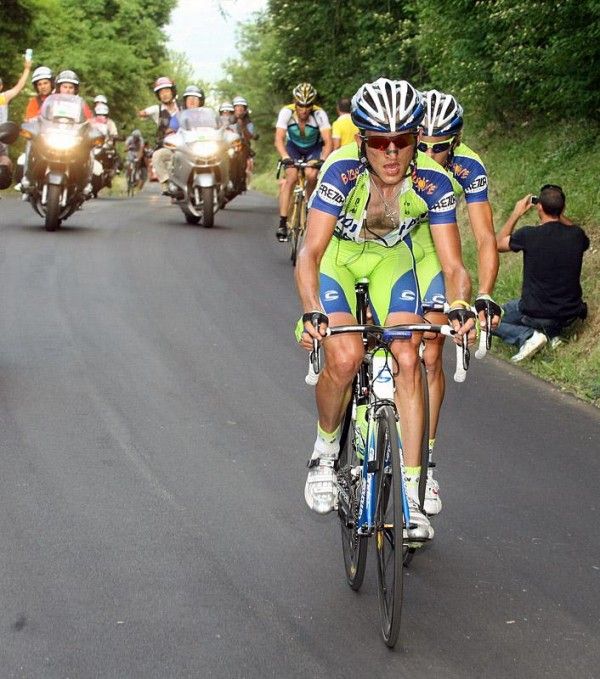 Liquigas teammates Sylvester Szmyd and Franco Pellizotti attack the peloton while Lance Armstrong tries to bridge across.