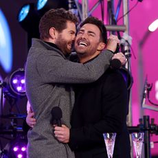 Jaymes Vaughan (L) and Jonathan Bennett speak onstage during the Times Square New Year's Eve 2022 Celebration on December 31, 2021 in New York City