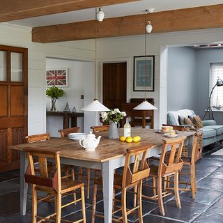 dining area with pendant light over wooden dining table