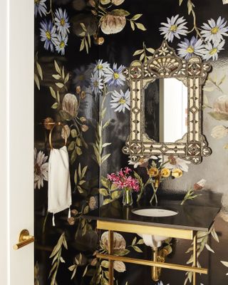 A small powder room with an eye-catching wallpaper