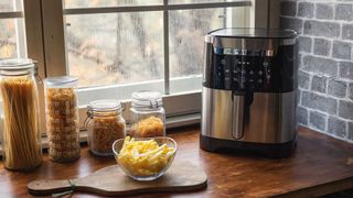 An air fryer in the corner of the kitchen in it's own dedicated area