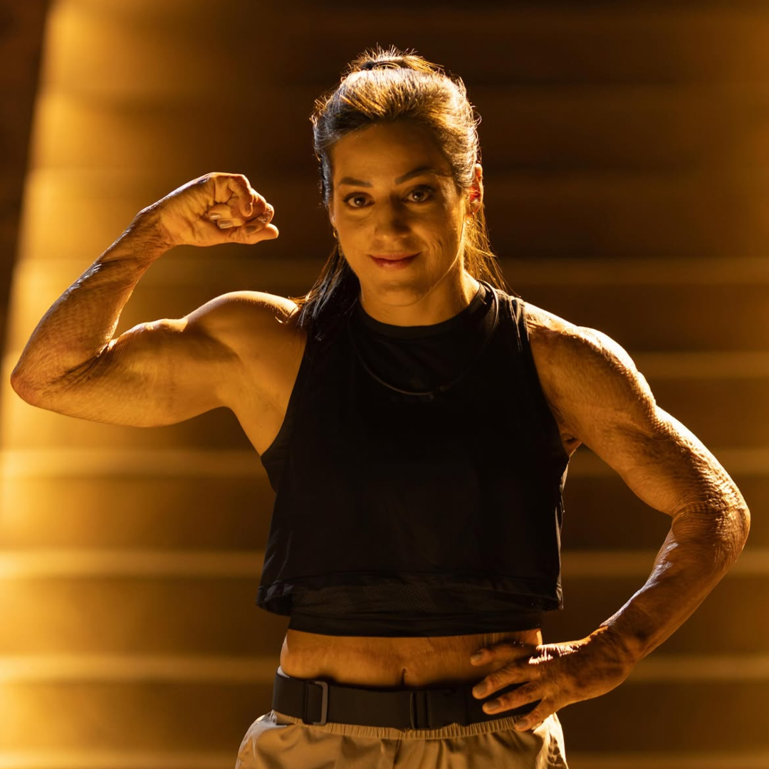 'Physical 100: Mexico' star Mariana Khalil poses while flexing a bicep.