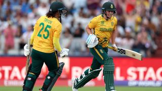 Marizanne Kapp and Chloe Tryon of South Africa celebrate victory in the ICC Women's T20 World Cup Group A match between South Africa and India