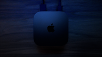 An Apple TV 4K streamer in dim lighting