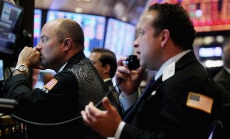 Traders work on the floor of the New York Stock Exchange