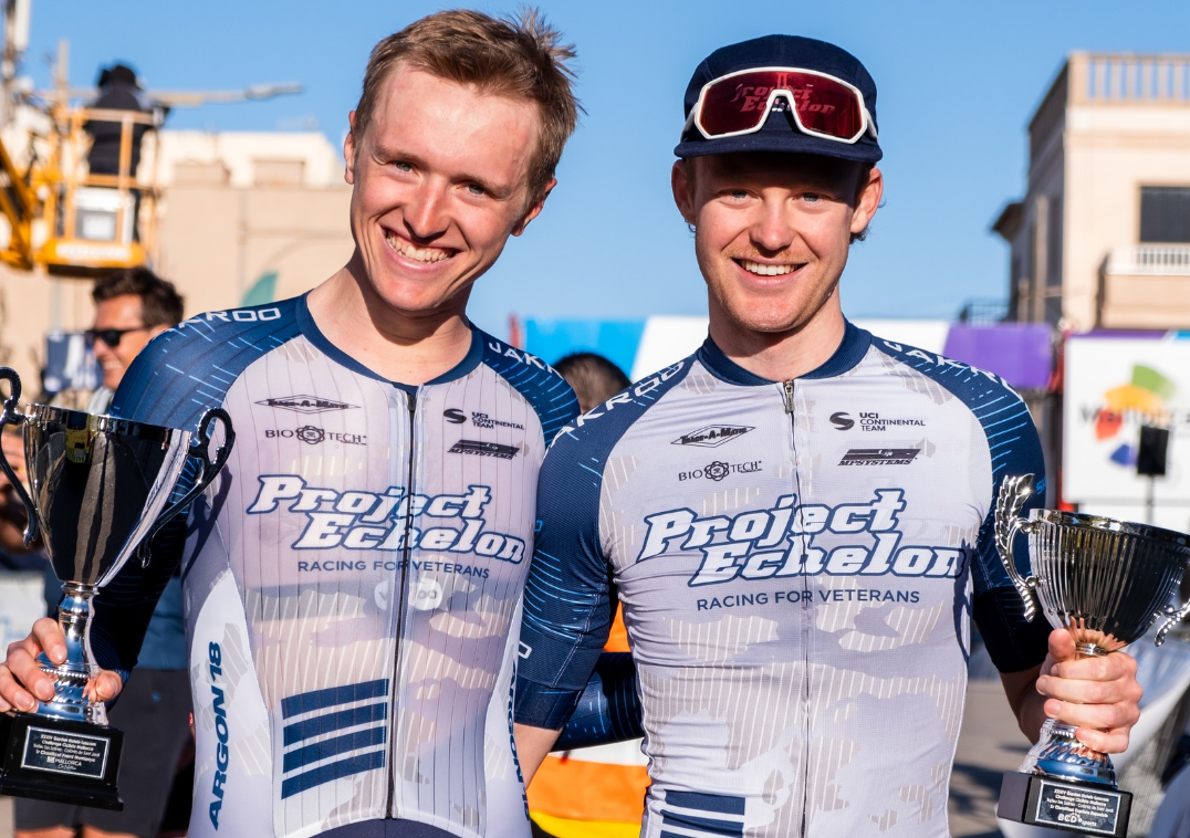 Colby Lange (left) holds KOM trophy and Ethan Craine (right) holds sprint classification trophy from 2025 Trofeo Ses Salines-Felanitx in Mallorca