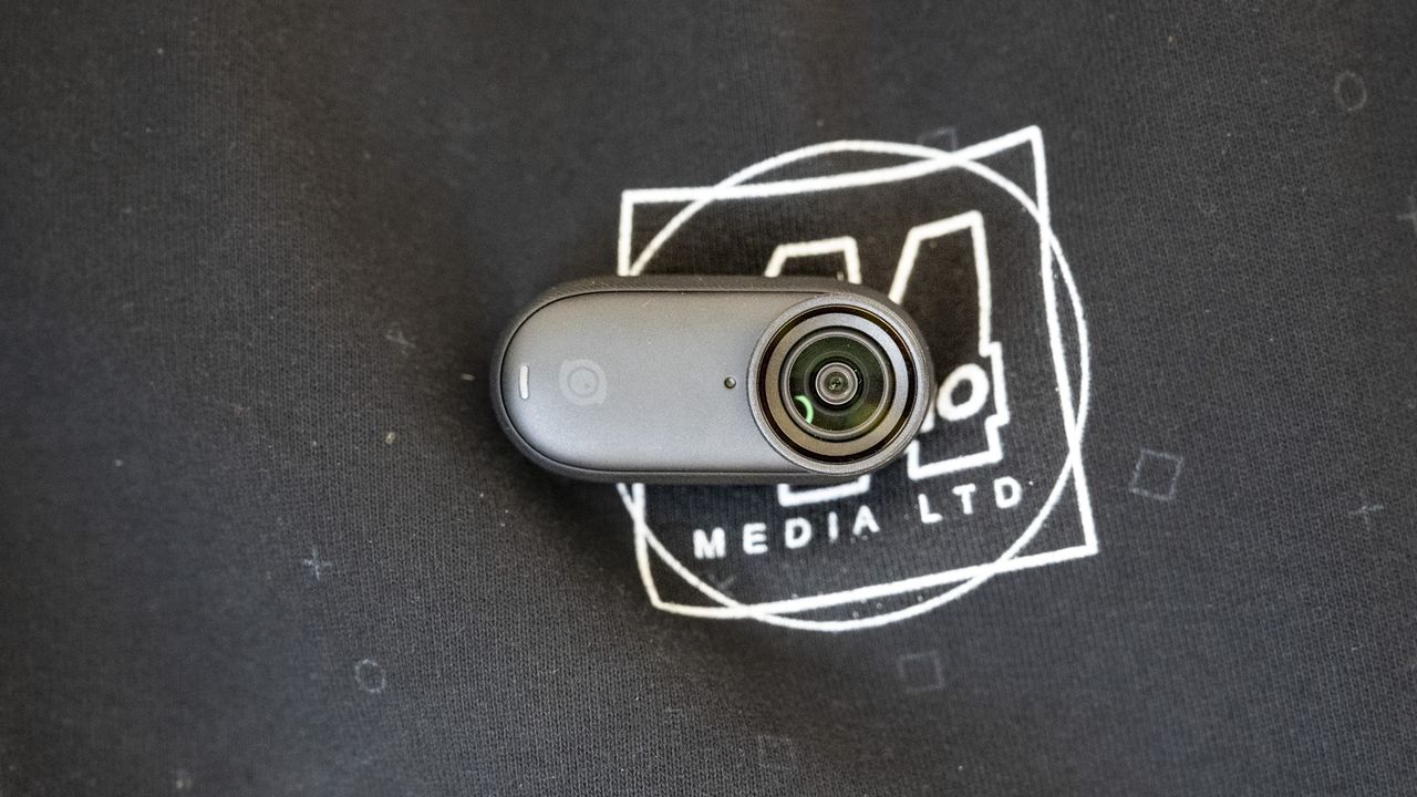 Insta360 Go 3S camera attached to a sweater magnetically