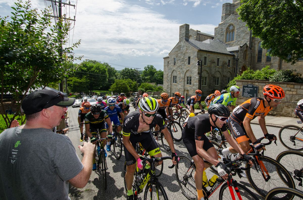Fans cheer as the men hit the climb
