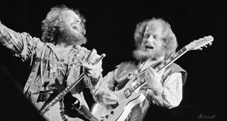 Ian Anderson and Martin Barre of Jethro Tull onstage in 1982, with Barre soloing on his Hamer doublecut – and Anderson looking wild.