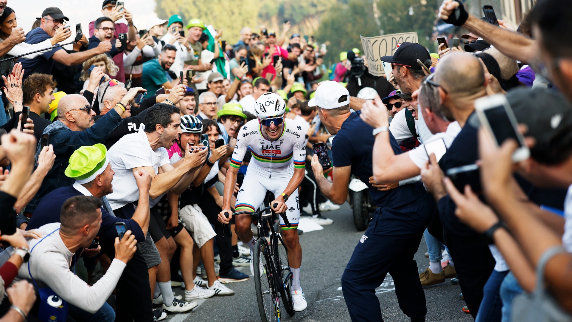 Tadej Pogacar surrounded by fans
