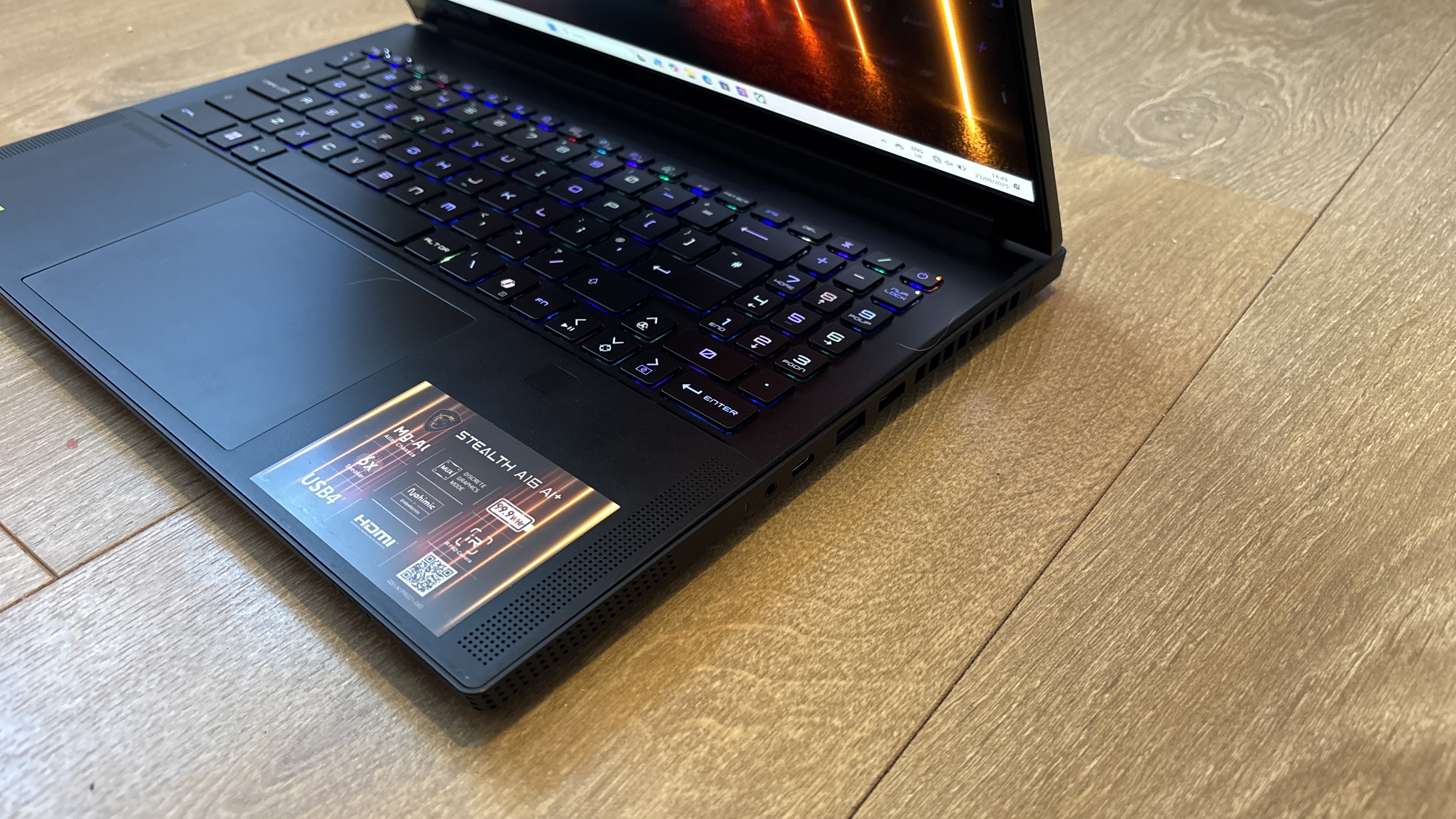 MSI Stealth A16 AI+ on wooden surface