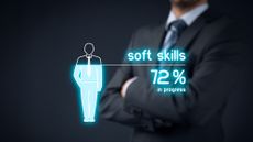 An outline of a drawing of a man filling up from the bottom with soft skills training, currently at 72%, with a real businessman out of focus in the background