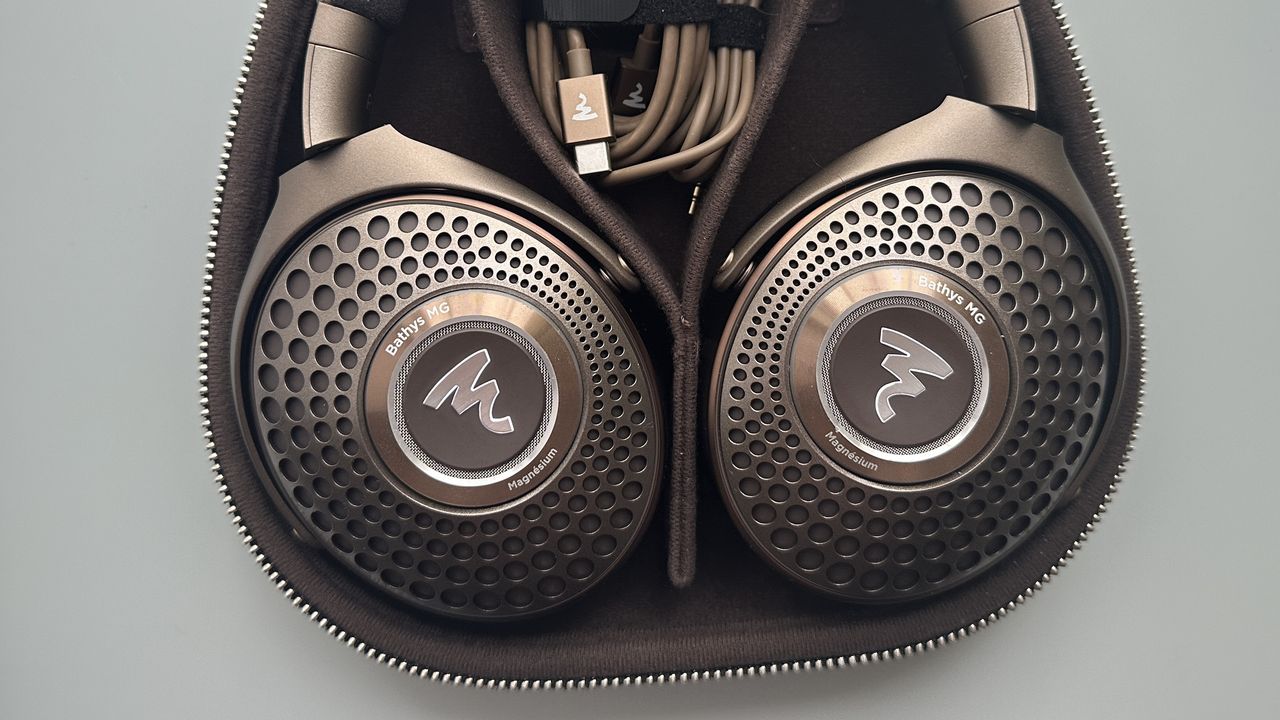 Focal Bathys Mg in bronze, featuring ear cup detail on gray background