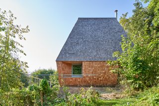 Haus Anton II, a timber dwelling by manfred lux, using wood to radical purism