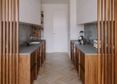 Wooden galley kitchen with partition
