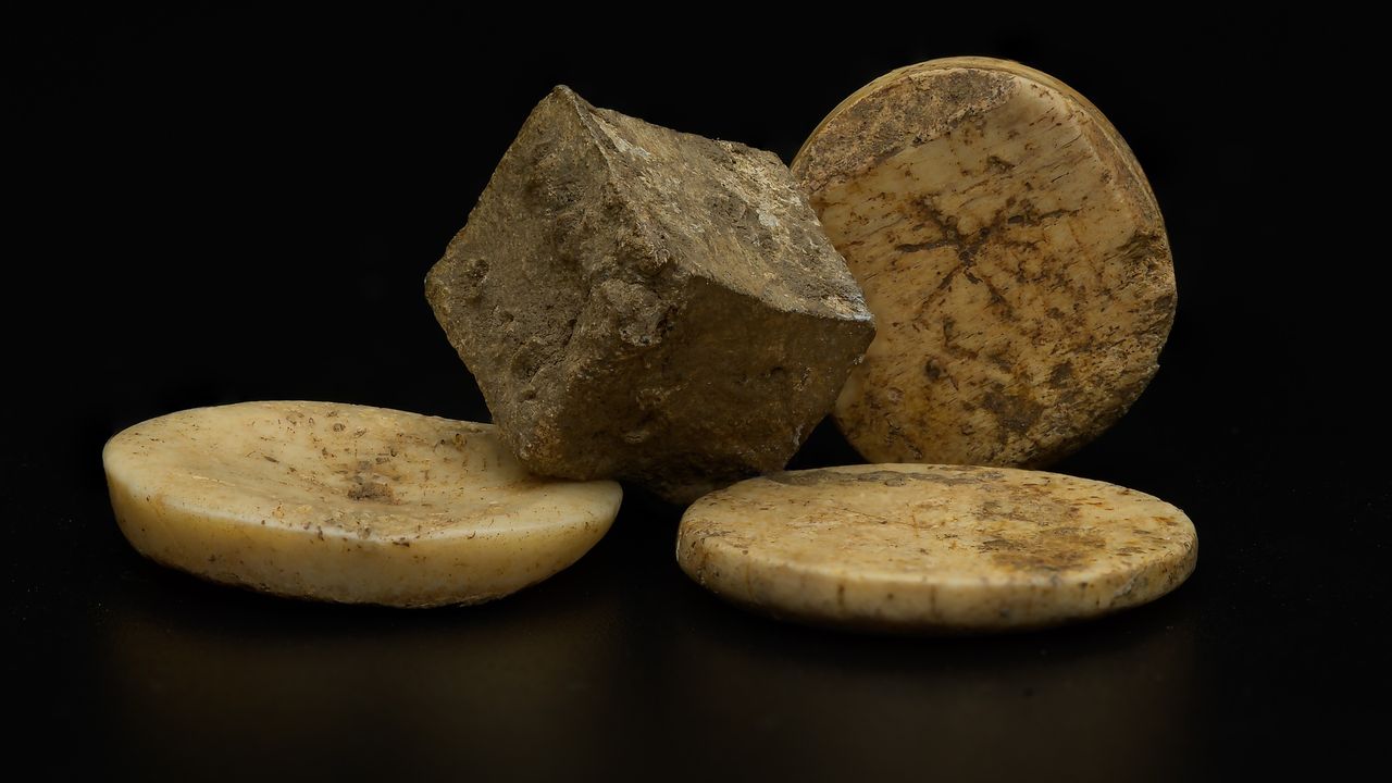 Roman (lead) die (bone) gaming pieced uncovered during the archaeology excavation at Blackgrounds, Chipping Warden