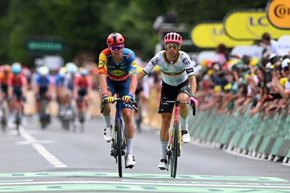 Mads Pedersen is helped across the line on stage 5 by Rui Costa after his crash