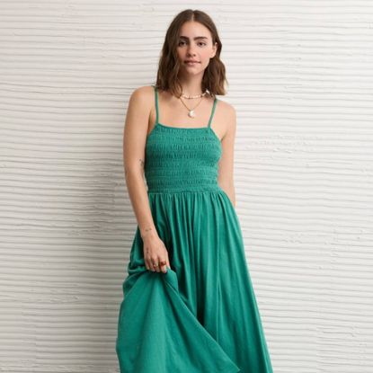 Woman wearing green American Eagle dress