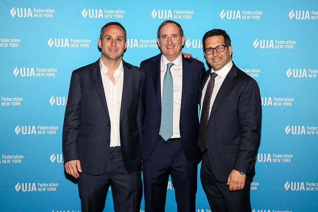 At the UJA-Federation of New York&rsquo;s &ldquo;Sports for Youth Annual Luncheon&rdquo; at Gotham Hall (l. to r.): Michael Rubin, CEO, Fanatics; Gary Gertzog, president of business affairs, Fanatics, and winner of the David J. Stern Leadership Award; and event emcee Adam Schefter, ESPN NFL reporter.
