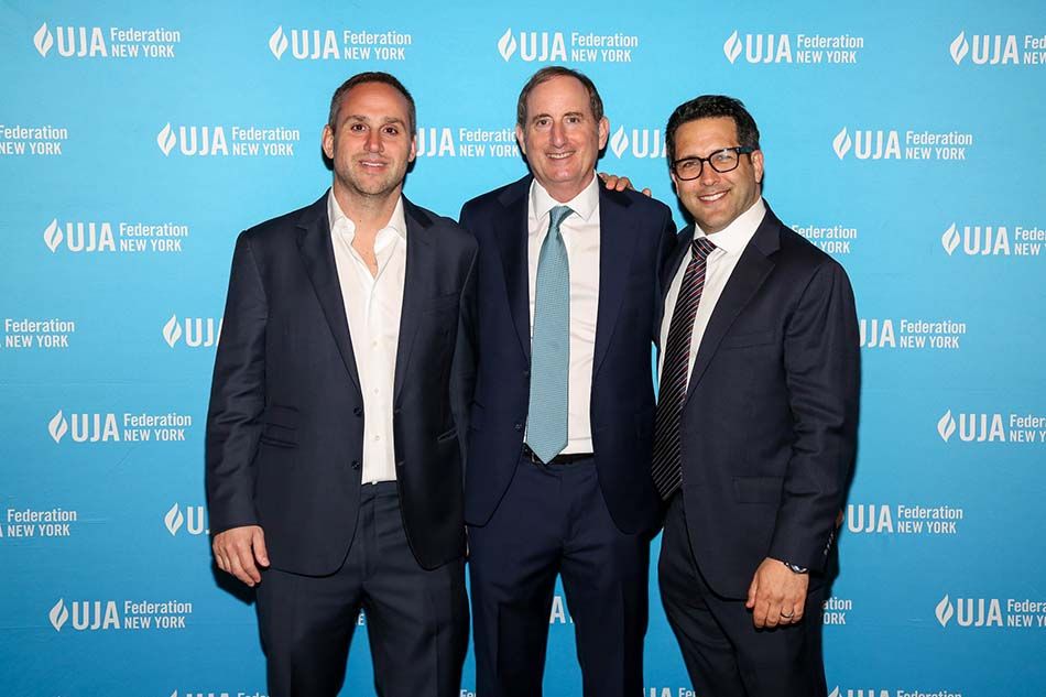 At the UJA-Federation of New York&rsquo;s &ldquo;Sports for Youth Annual Luncheon&rdquo; at Gotham Hall (l. to r.): Michael Rubin, CEO, Fanatics; Gary Gertzog, president of business affairs, Fanatics, and winner of the David J. Stern Leadership Award; and event emcee Adam Schefter, ESPN NFL reporter.