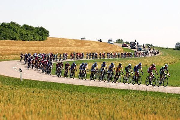 Riders get strung out through the countryside.
