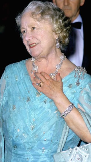 The Queen Mother at an evening engagement wearing the ring later given to Camilla Parker-Bowles