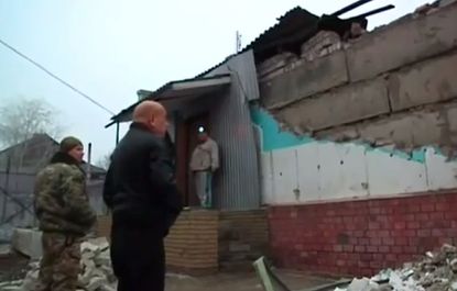 Locals look at damage in Debaltseve, Ukraine