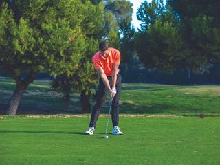 Gary Munro demonstrating the correct impact position with a long iron