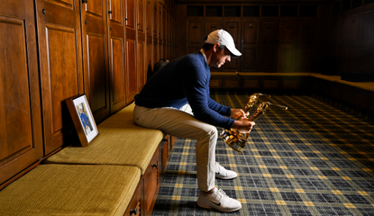 Rory McIlroy stares at two Players Championship trophies