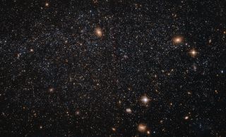 The speckling stars of the dwarf galaxy Leo A shine in this stunning photo by the Hubble Space Telescope released on April 15, 2016.