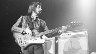 Bassist John Entwistle of the rock and roll band "The Who" performs onstage in February 1975.