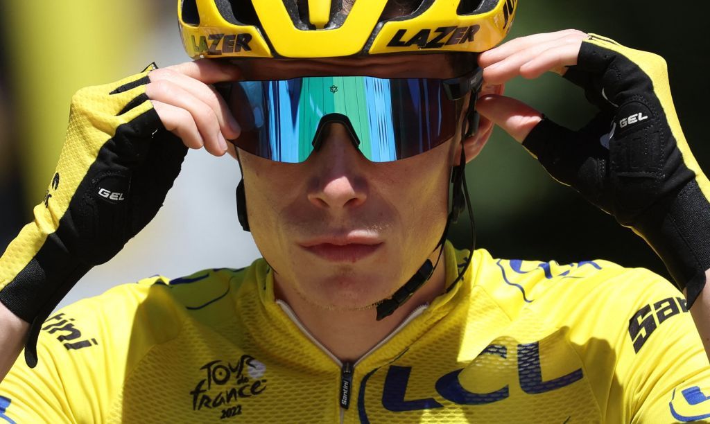 JumboVisma teams Danish rider Jonas Vingegaard wearing the overall leaders yellow jersey adjusts his glasses as he awaits the start of the 13th stage of the 109th edition of the Tour de France cycling race 1926 km between Le Bourg dOisans in the French Alps and SaintEtienne in central France on July 15 2022 Photo by Thomas SAMSON AFP Photo by THOMAS SAMSONAFP via Getty Images