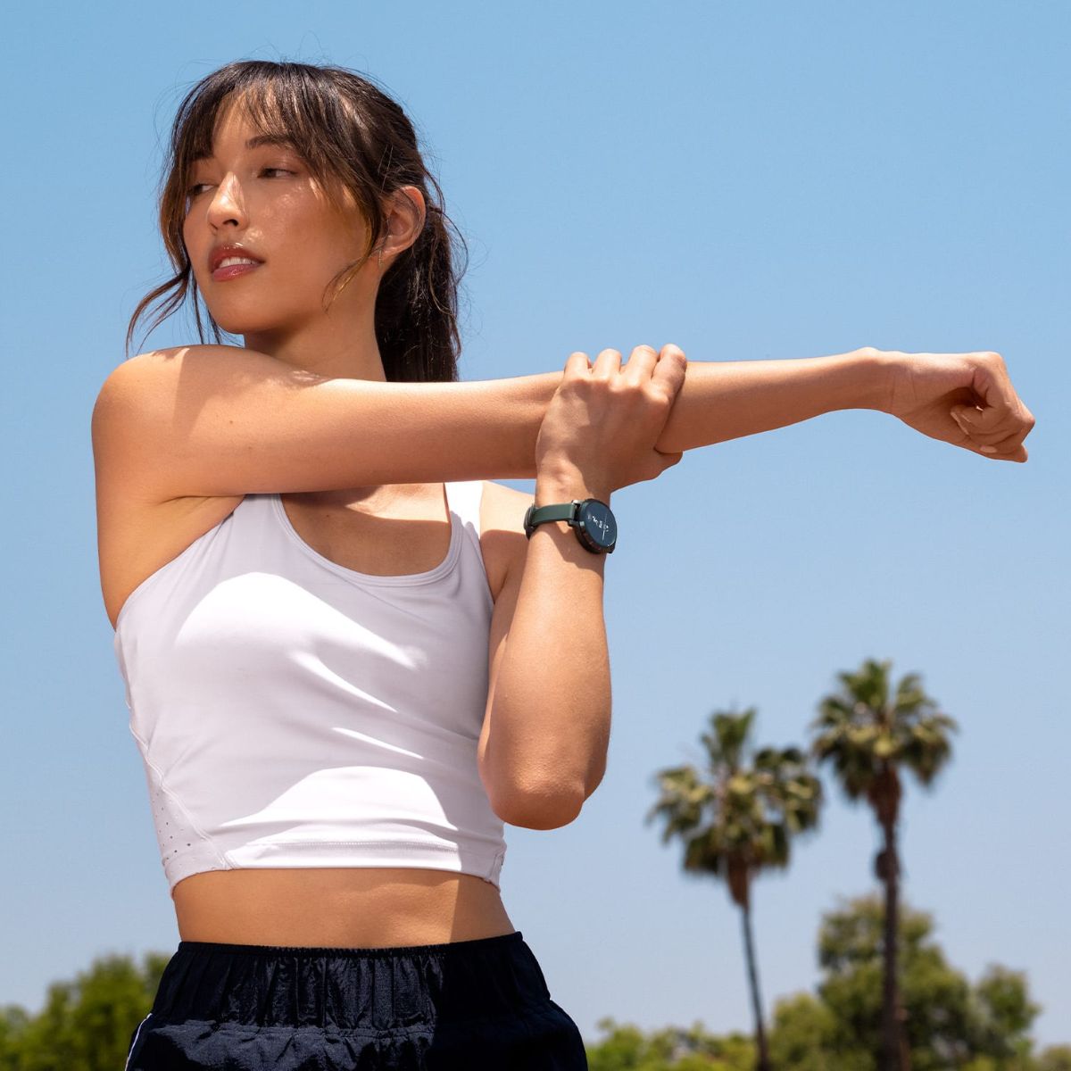 woman wearing garmin lily 2 watch