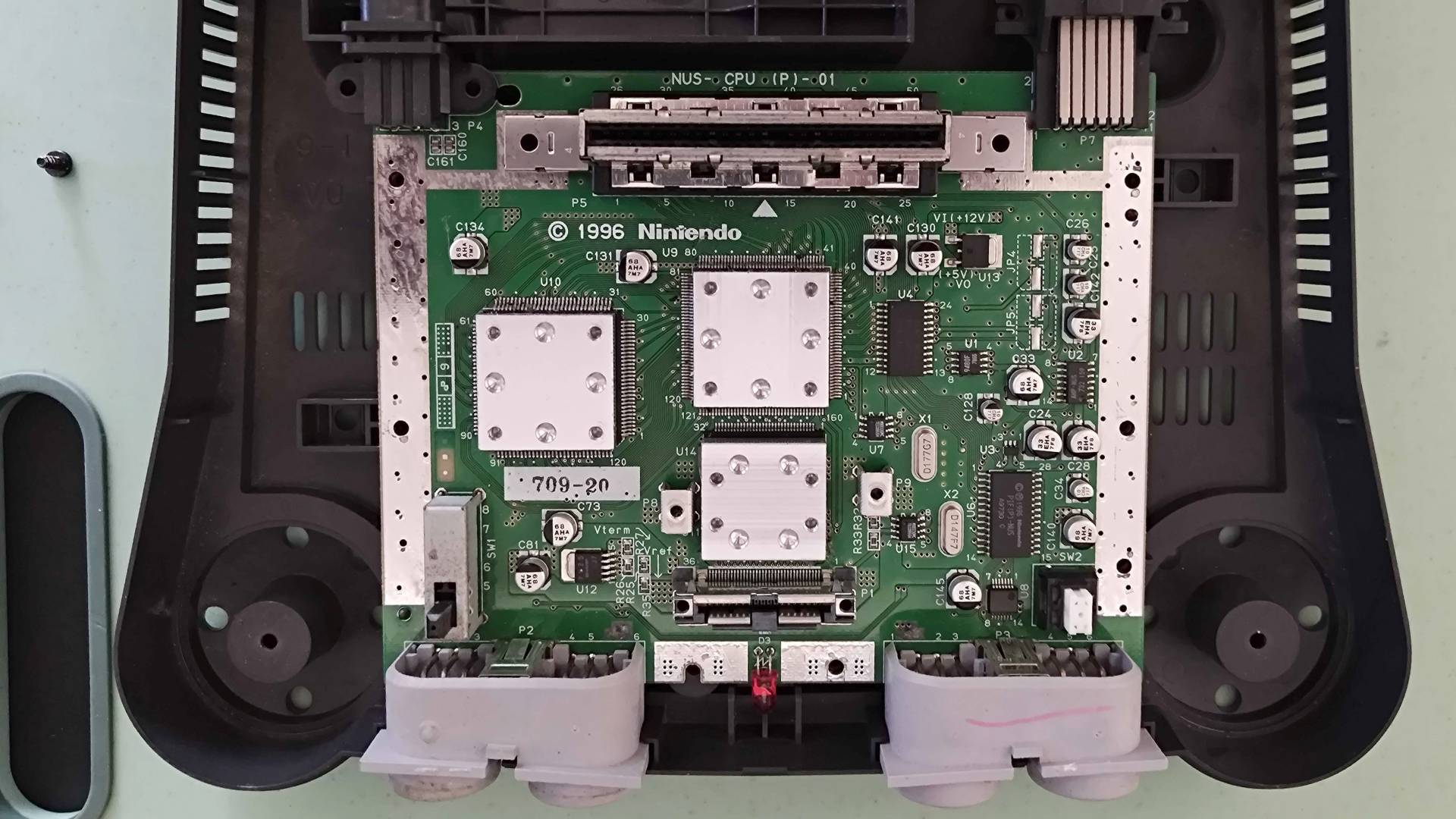 N64 with shielding removed to reveal main board and chips.