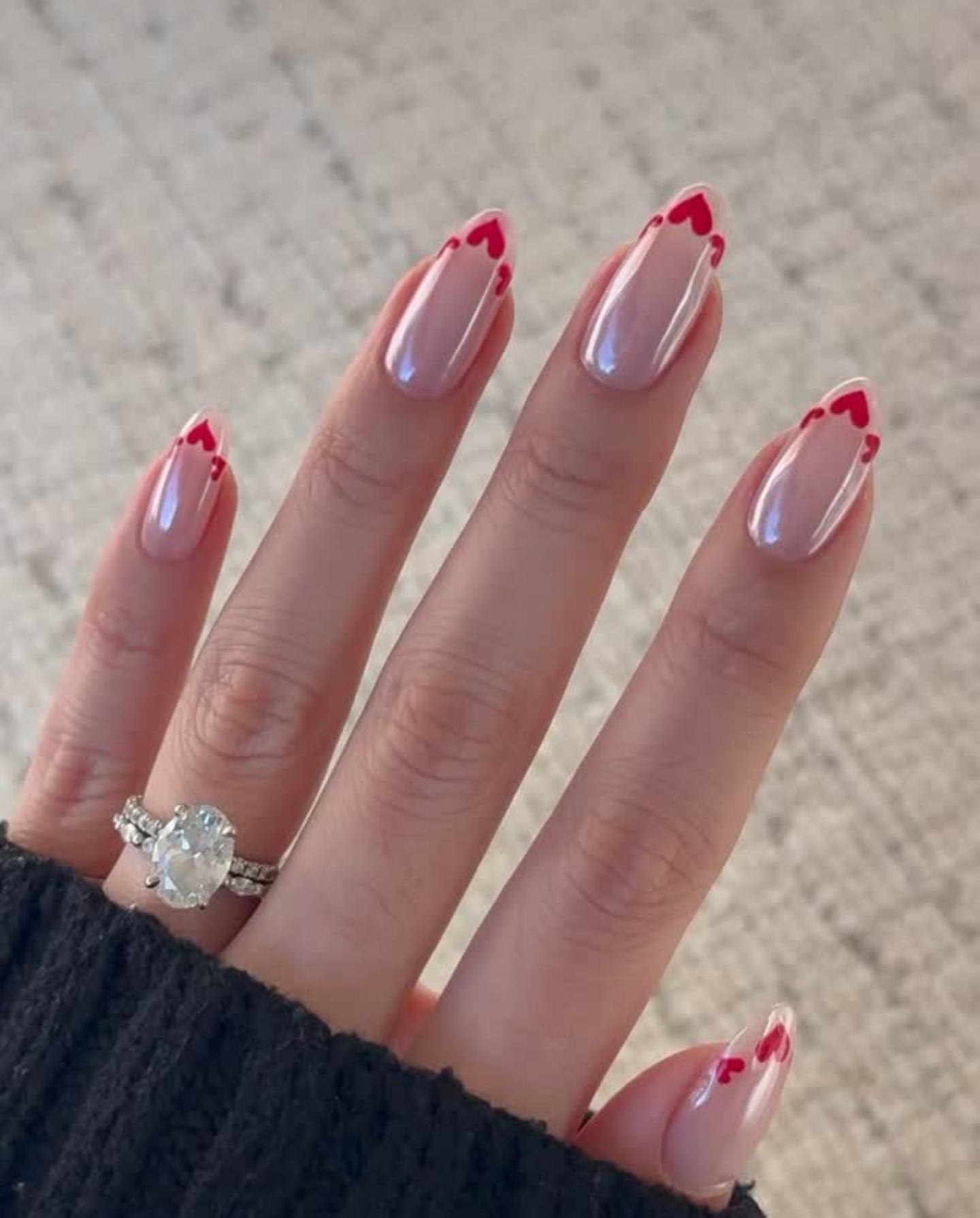 A French manicure with playful, heart tips by Zola Ganzorigt