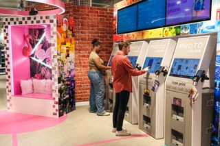 Pictures of a photo booth area and printers in the Birmingham Primark Instax PHOTO area