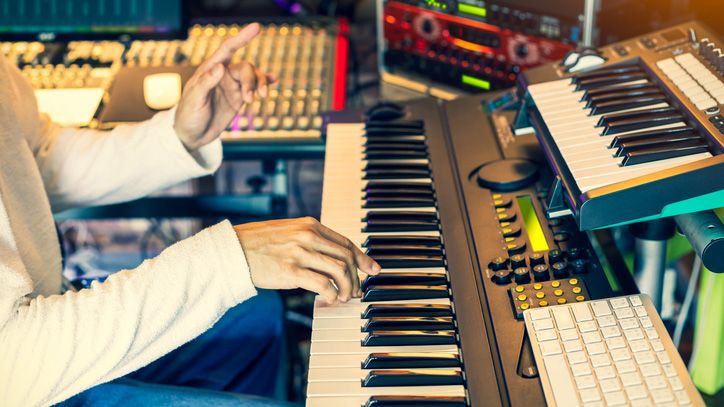 Man composing on a keyboard