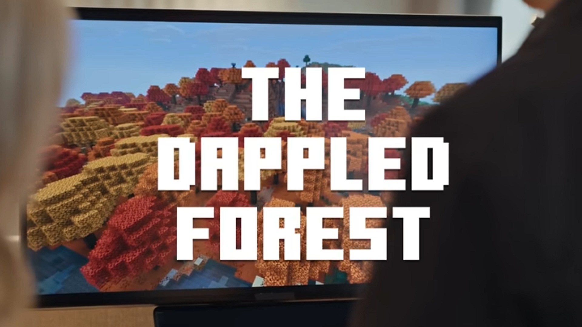 The words "The Dappled Forest" over a preview of the next Minecraft update.