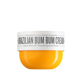 A 75ml round, orange bottle of Sol De Janeiro Brazillian Bum Bum Cream.