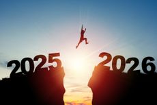 Shadowed image of a person jumping from a rock cliff with 2025 on it to a rock cliff with 2026 on it.