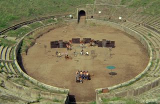 Pink Floyd setting up at an empty Pompeii wide shot