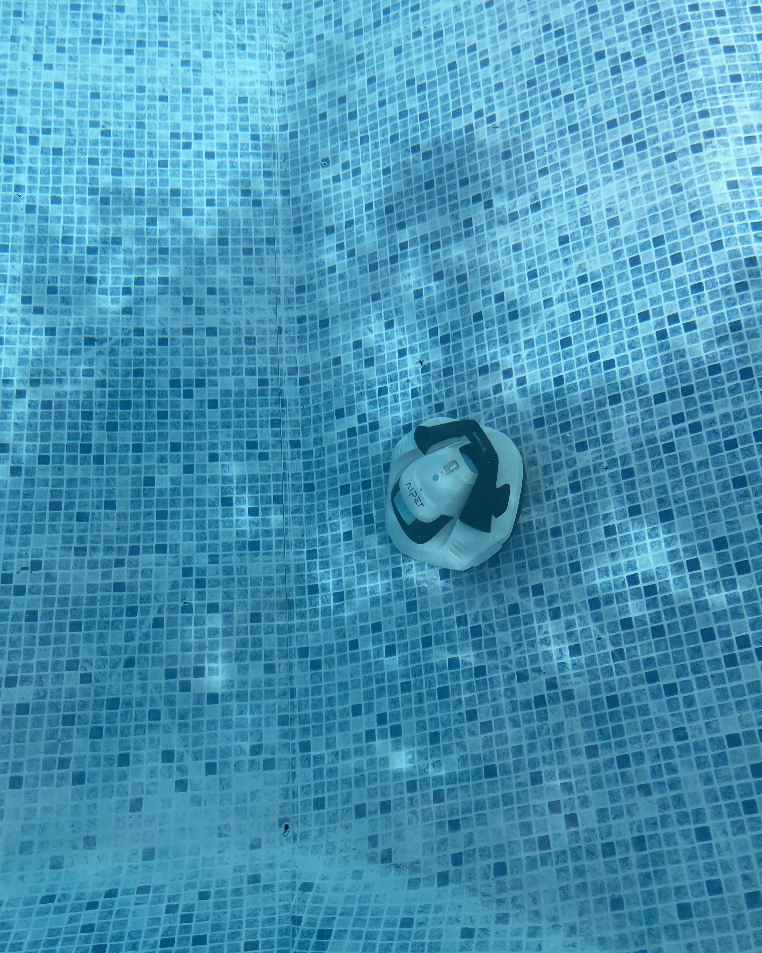 A robot pool cleaner going up a 45 degree slope