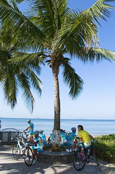 The boys from Astana gather in the shade beneath a palm in Sanya on a hot and steamy final day of the tour.