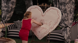 Annie punching through a heart in Bridesmaids.