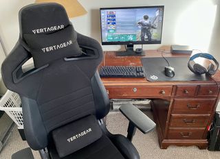 The Vertagear PL4500 gaming chair in front of computer